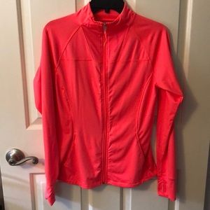 Salmon colored zip up warm up jacket